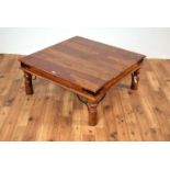 A contemporary Indian hardwood coffee table of square form