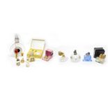 An assortment of designer glass perfume bottles; and other perfume atomizers