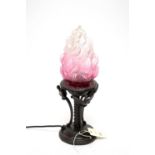 A bronzed table lamp, with Art Deco style ombré glass flame motif shade