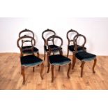 A set of six Victorian mahogany balloon-back dining chairs