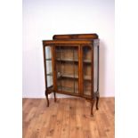 An early 20th Century oak glazed bookcase