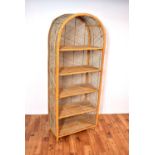 A retro vintage mid 20th Century rattan shelving unit