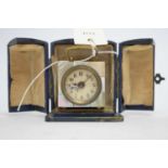 An early 20th Century bedside travel clock