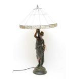 A Victorian style bronzed figural table lamp