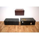 Two 20th Century ebonised metal travelling trunks of rectangular form; and a mahogany box