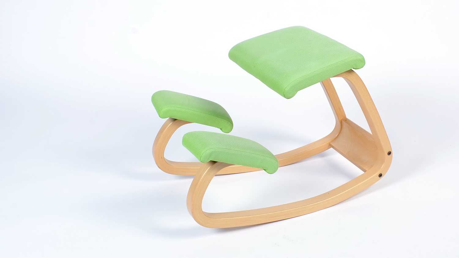 Stokke after a design by Peter Opsvik: a bent plywood rocking/kneeling chair.
