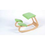 Stokke after a design by Peter Opsvik: a bent plywood rocking/kneeling chair.