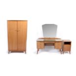 Alfred Cox for A.C. Furniture: a mid Century teak and walnut bedroom suite.