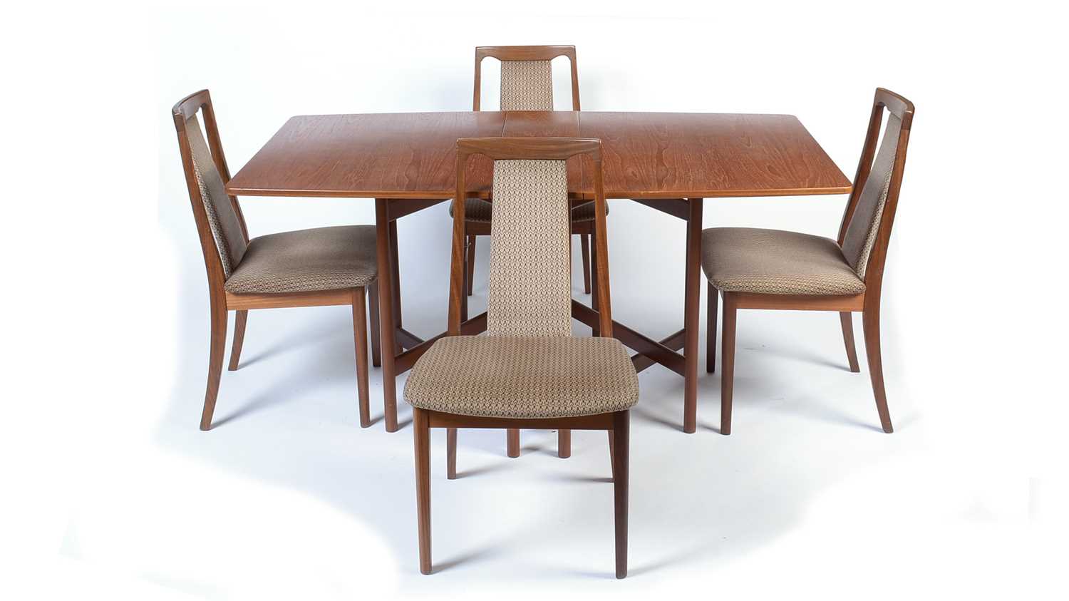 Attributed to G-Plan: teak drop leaf dining table; and four G-Plan dining chairs.