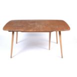 Ercol: a Windsor elm and beech extending dining table.