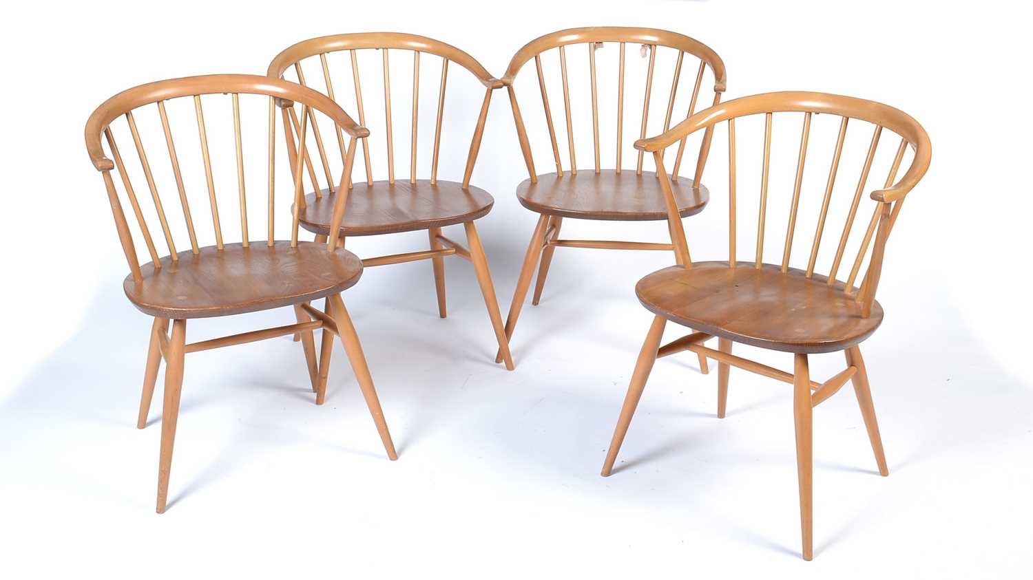 Ercol: a set of four No. 449A Windsor bow-top armchairs.