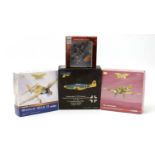 A group of four boxed die-cast scale-model model airplanes