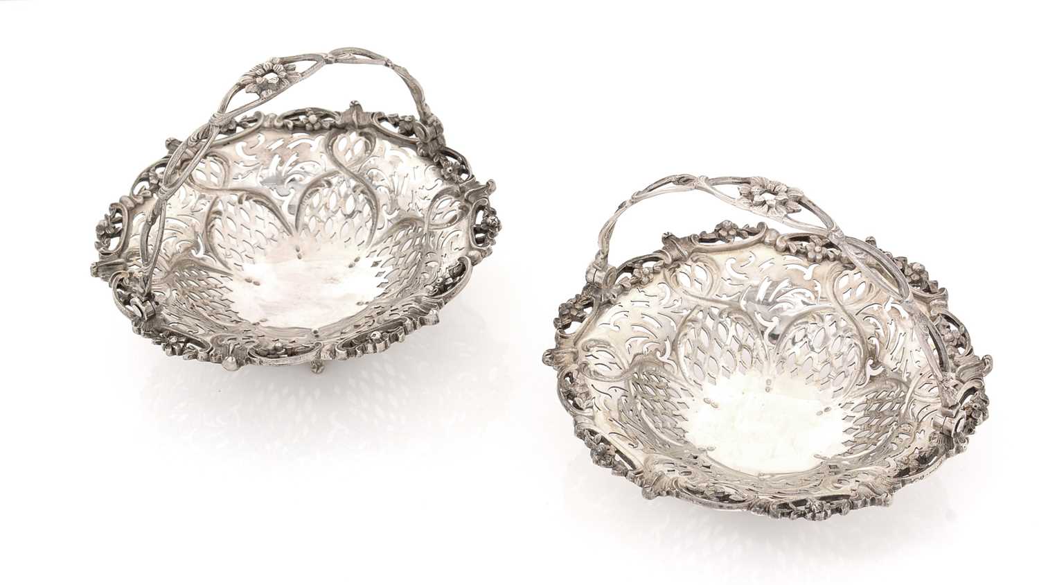 A pair of late Victorian silver bonbon dishes.