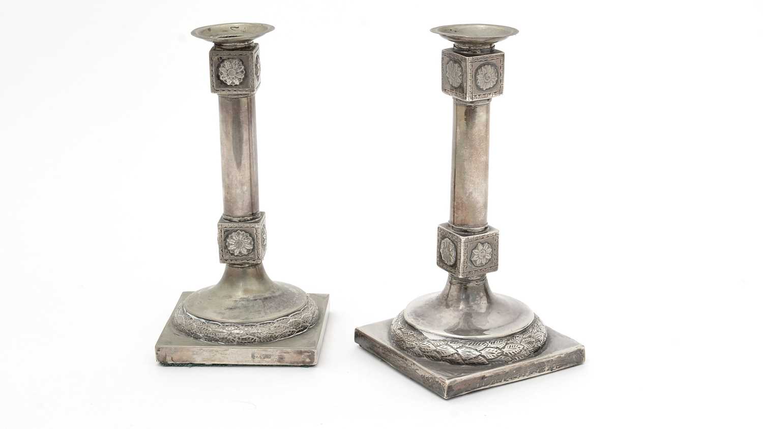 Two very similar late 18th/early 19th Century candlesticks.