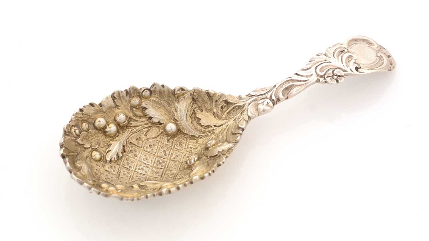 A Victorian silver cast caddy spoon.