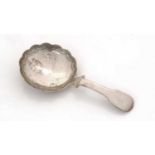 A George III silver caddy spoon.