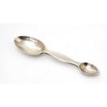 A Victorian silver medicine spoon.