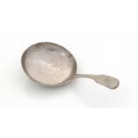 A William IV silver Provincial caddy spoon.