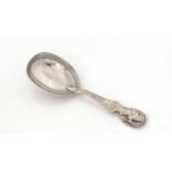 A Victorian silver caddy spoon.