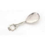 A George V caddy spoon.