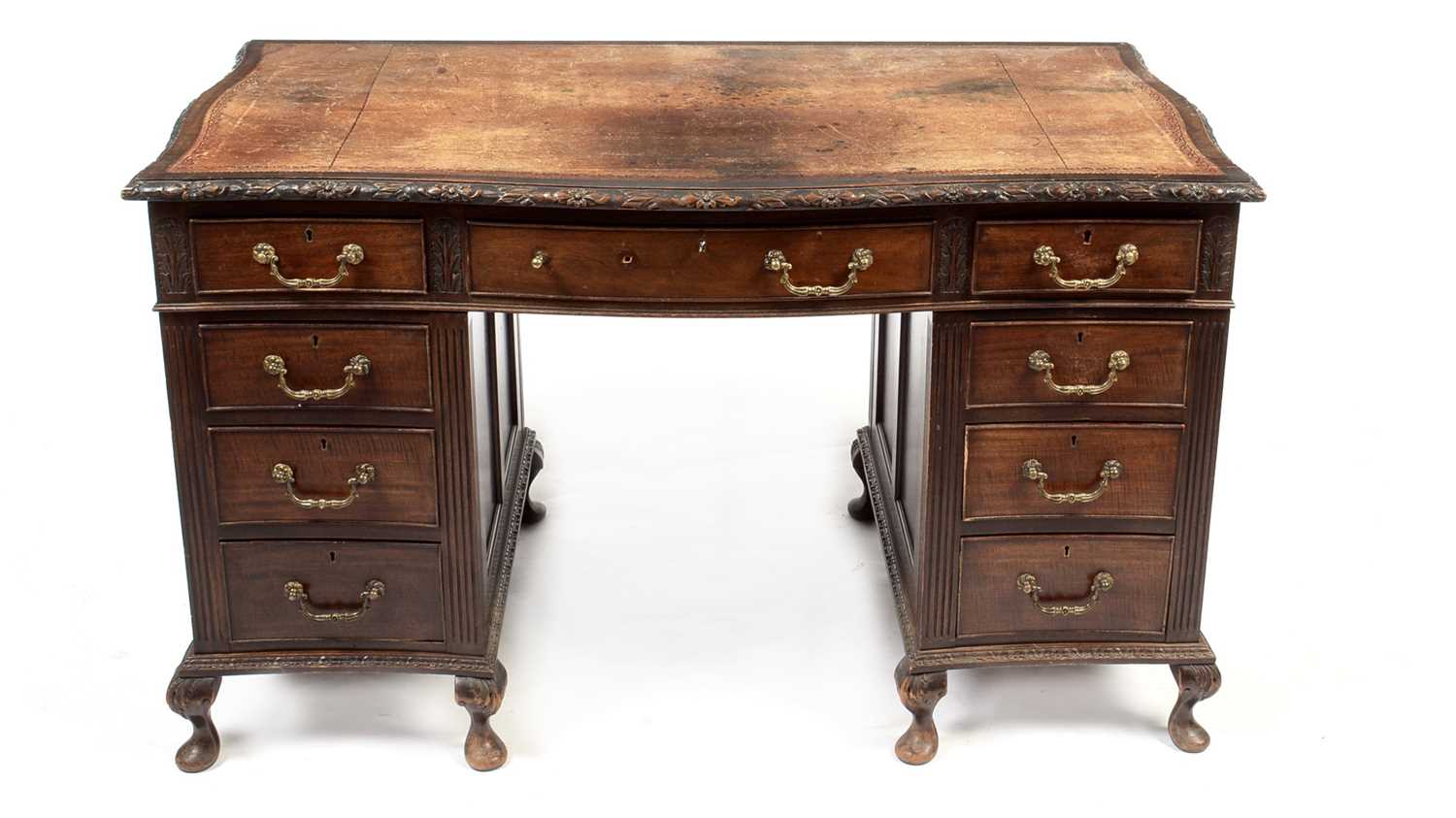 Late 19th century carved mahogany serpentine pedestal desk