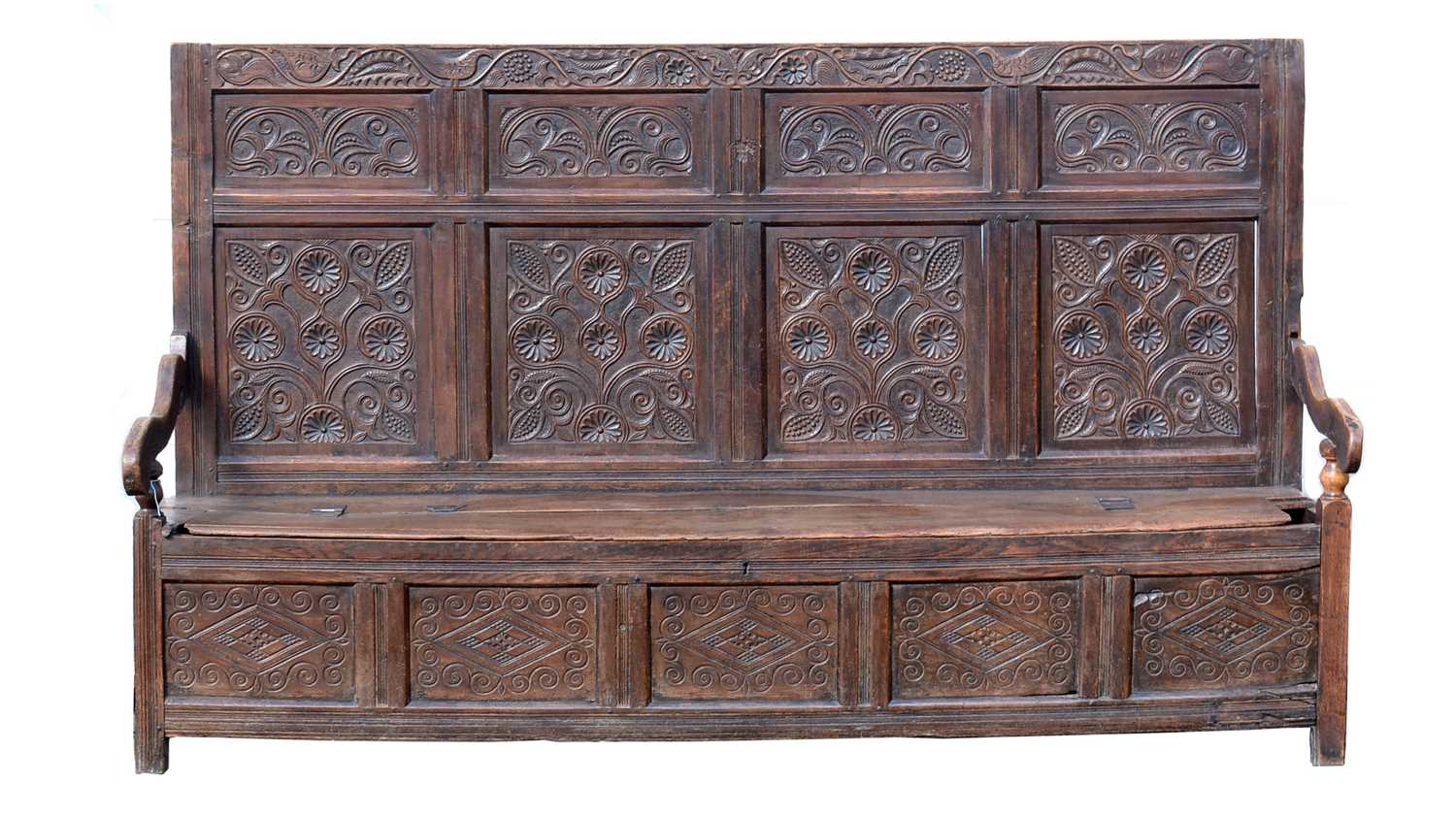 A North Country joined and carved oak box settle.