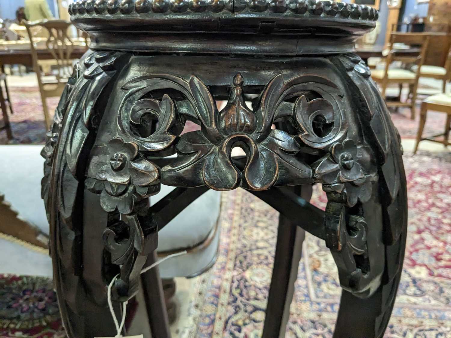 A Chinese carved hardwood circular jardiniere stand. - Image 9 of 17