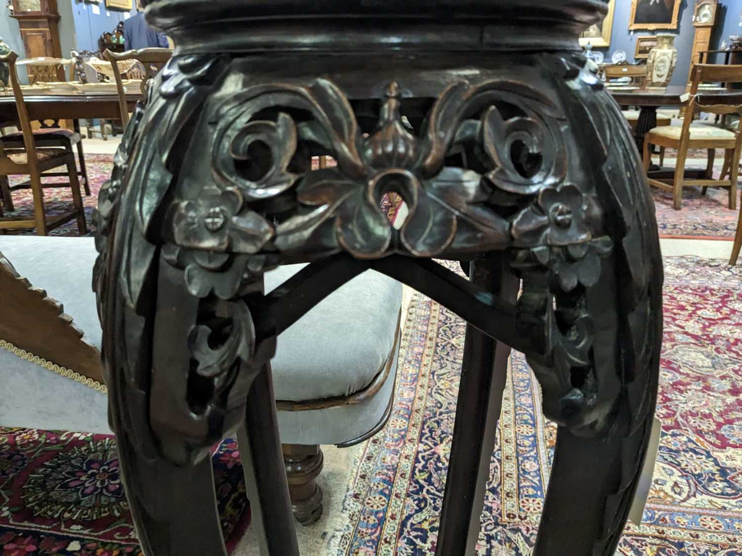 A Chinese carved hardwood circular jardiniere stand. - Image 11 of 17