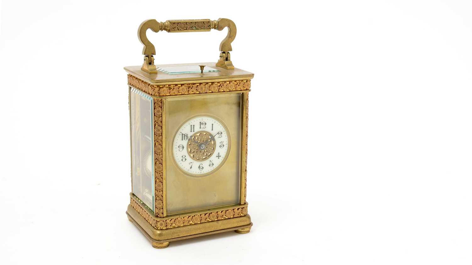 An ornate late 19th Century French gilt brass repeating carriage clock.