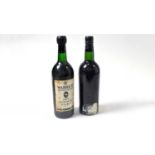 Two bottles of Warre's Vintage Port,