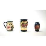 Two small Moorcroft vases and a jug.