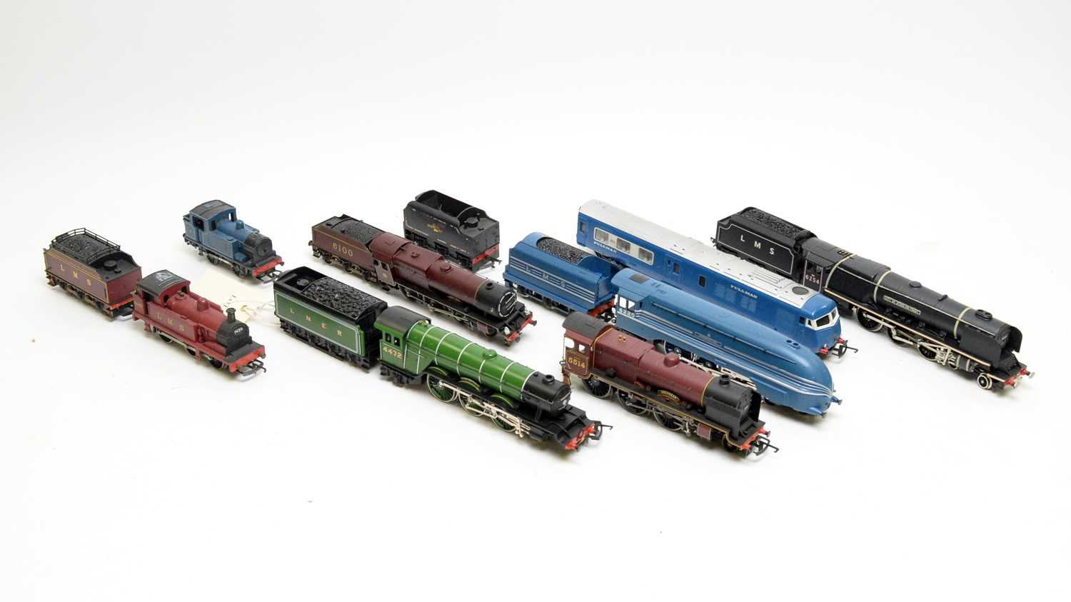 A selection of 00-gauge model railway locomotives and some tenders
