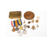 A selection of WWI medals and ephemera.