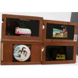 A collection of Victorian hand-painted mahogany framed Magic Lantern Slides