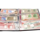 An album of Indian banknotes,