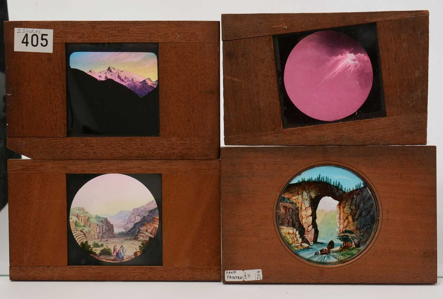 A collection of 27 Victorian mahogany framed hand painted lantern slides