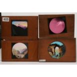 A collection of 27 Victorian mahogany framed hand painted lantern slides