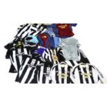 A large selection of Newcastle United football shirts,