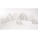 A collection of clear glass wildlife paperweights, two by Mats Jonasson