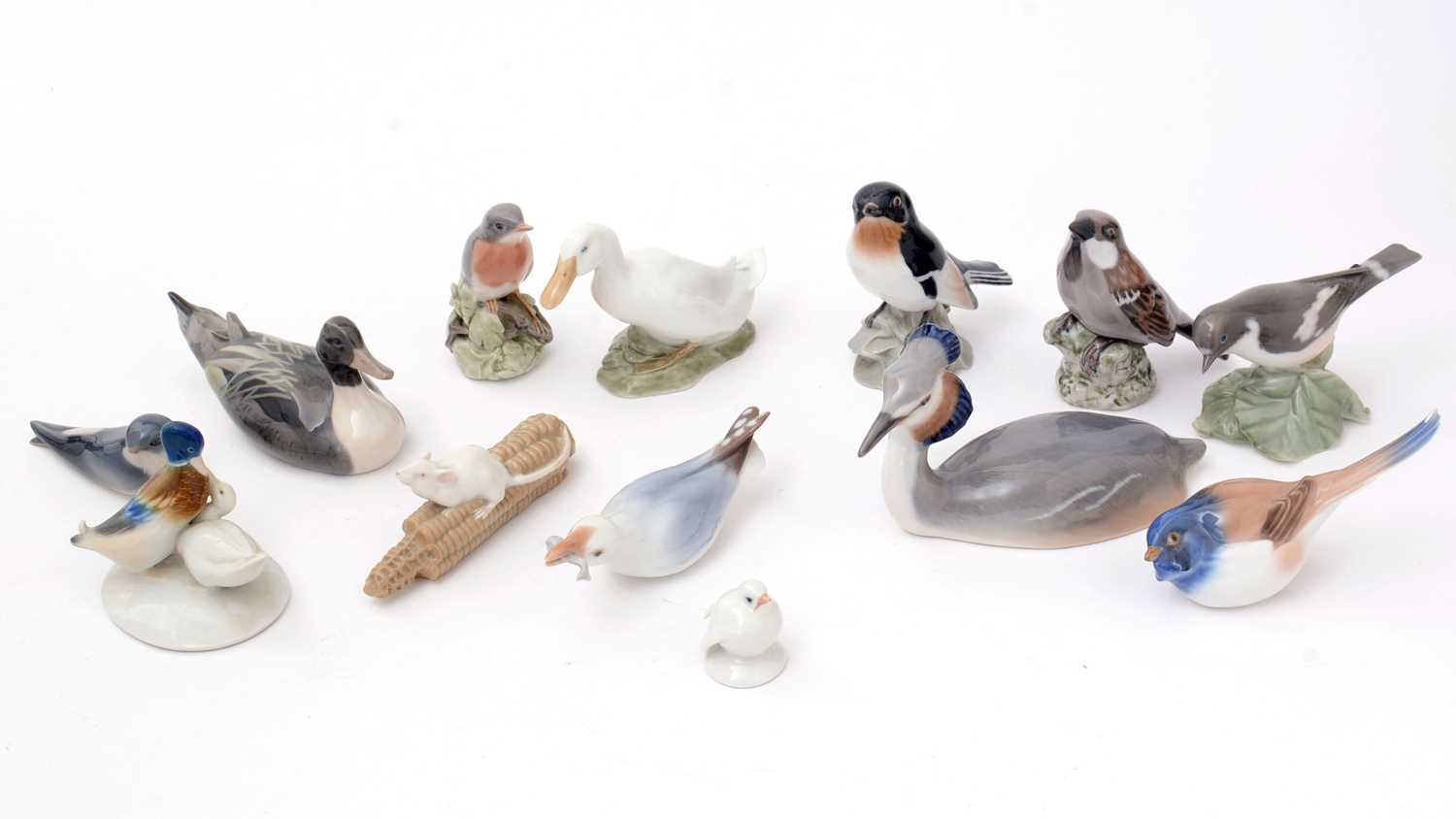 A selection of Royal Copenhagen figures, primarily of birds.