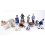 A selection of Royal Copenhagen and Bing and Grondahl animal and figural groups.