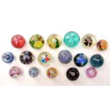A collection of 20th Century glass paperweights,