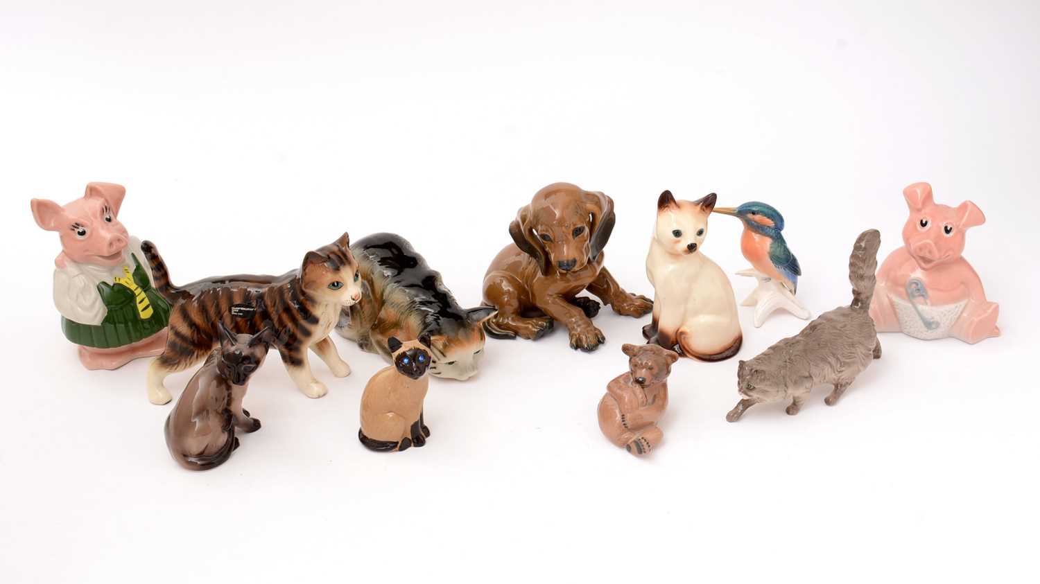 A selection of animal figures and two Wade pig money banks.