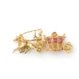 An 18ct yellow gold and ruby brooch, in the form of a horse-drawn carriage