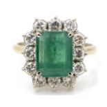 An emerald and diamond cluster ring,