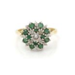 An emerald and diamond cluster ring,