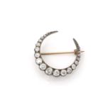 A Victorian diamond crescent brooch,