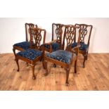 A set of five oak Chippendale style dining chairs