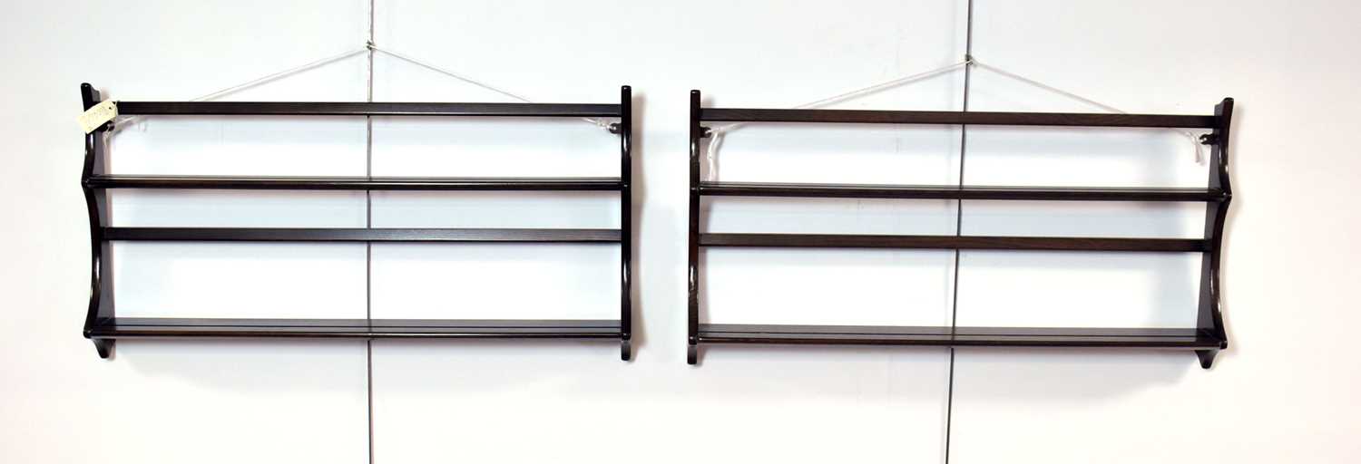 A retro vintage mid 20th Century Ercol elm two-tier plate rack; together with another plate rack