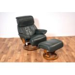 A contemporary Ekornes Stressless leather reclining armchair and matching ottoman footstool